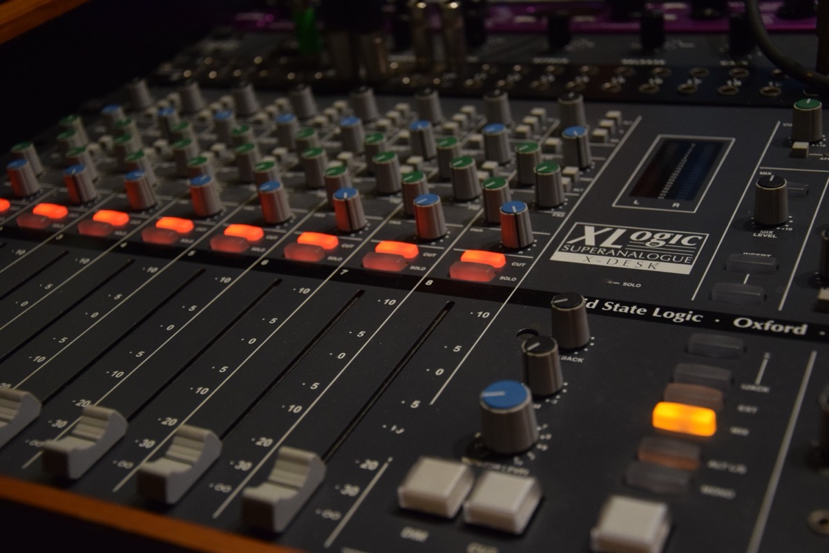 Channel strips along an analogue mixing console
