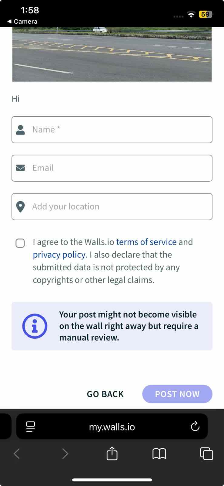 Walls.io attendee submission form on a phone, showing a photo preview, a required Name field, optional Email and Location fields, the consent checkbox declaring the submitted data is not protected by copyright, and a notice that the post may require manual review